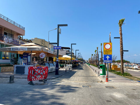 Urla, Izmir, Turkey - Sept 10, 2023:  Street view and old style buildings, caffee shops and bars in narrow streets of Urla. Urla is popular tourist attraction in Izmir,  Aegean Turkey.