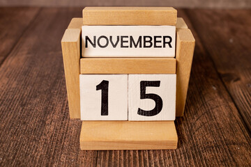 15 November on wooden grey cubes. Calendar cube date 15 November. Concept of date.