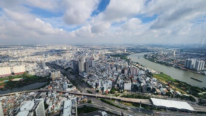 Aerial view of a city with buildings and a river flowing through