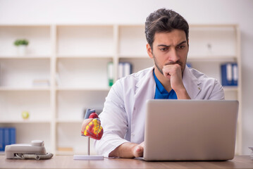 Young male doctor in telemedicine concept