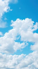 Background of blue sky with snow-white clouds. vertical background