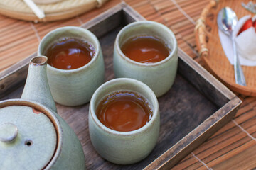 Japanese hot tea with dessert. Traditional teapot confectionery. Colorful Japanese sweets daifuku or mochi.