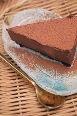 Dark chocolate fudge cake with cocoa powder. Homemade bakery. Birthday cake or valentine dessert. Home baking concept.