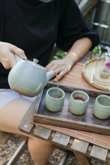 Japanese hot tea with dessert. Traditional teapot confectionery. Colorful Japanese sweets daifuku or mochi.
