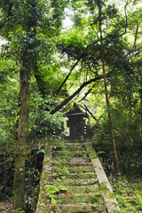 An old forgotten Shinto shrine deep in the forest