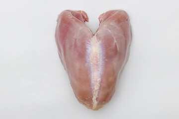 Isolated raw turkey breast on white background.