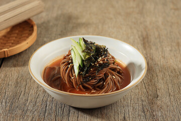 Korean Cold Soba Noodle Bibim Guksu with Cucumber, Nori Flakes, and Sesame Seed