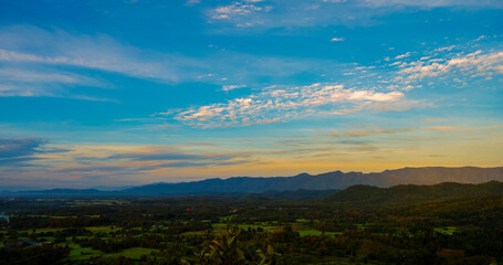 Blue golden sky sunrise dramatic beautiful landscape mountain. Dawn sky gold dusk time cloudscape with sunlight. Dramatic sunset over mountain landscape. Beautiful landscape foggy hills twilight time