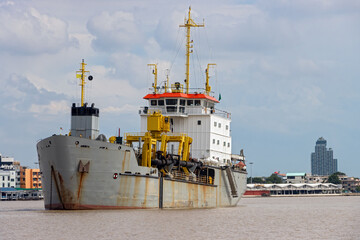 Trailing suction hopper dredger at entrance the Chao Phraya River, Thailand