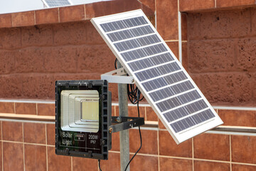 Reflector with solar panel fixed on a pole