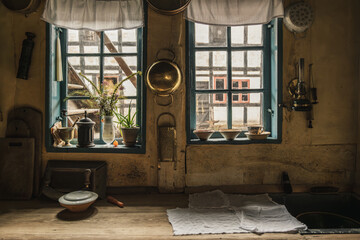 Interior view of old dirty and dark kitchen of traditional danish wooden houses.