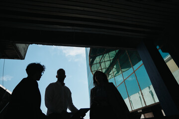 Business team in a meeting out in the city. Corporate business team working together remotely.