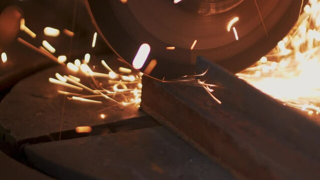 This stock video shows metal cutting with an angle grinder. This video will decorate your projects related to industry, metalworking, construction.
