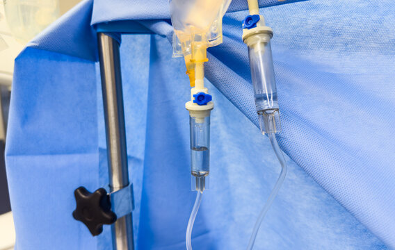 hospital IV drip, symbolizing healthcare, wellness, and life-saving therapy. Intravenous medication, drugs, and resuscitation equipment in a medical setting