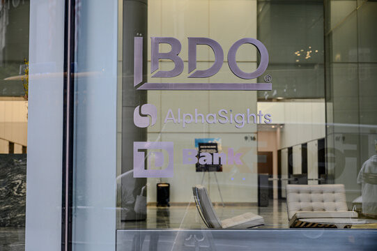 New York, New York, USA - October 12, 2023: A window in midtown Manhattan showing signage for BDO, AlphaSights and TD Bank