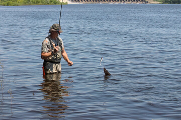 Fishing. One of a series of photos of fishermen catching northern pike.