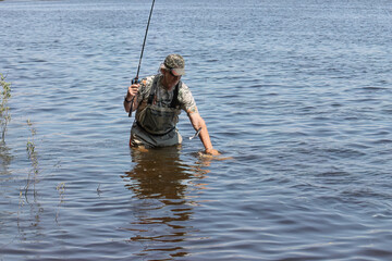 Fishing. One of a series of photos of fishermen catching northern pike.