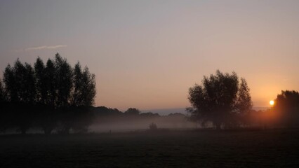Morning fog at sunrise in time-lapse, Bad Lippspringe, North Rhine-Westphalia, Germany, Europe