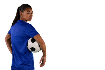 Digital png photo of serious biracial female footballer with ball on transparent background