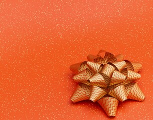 Gift bow on an orange background golden ribbon 3D render