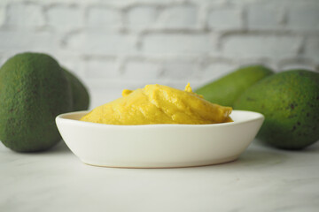 avocado and avocado pasted in a container