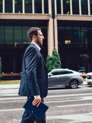 Entrepreneur walking near road in city