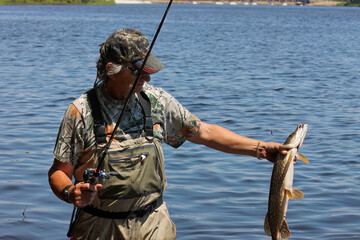 Fishing. One of a series of photos of fishermen catching northern pike.