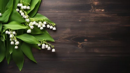 Wandaufkleber  Lily of the Valley Flower on Wooden Background with Copy Space © icehawk33