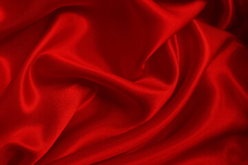 Dark red fabric texture background, detail of silk or linen pattern.