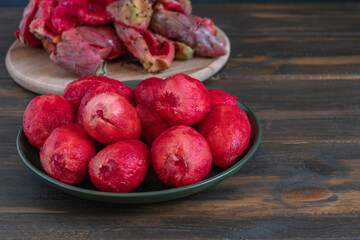 Peeled prickly pear on dark background. 