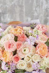 Small Beautiful bouquet of mixed flowers in woman hand. Floral shop concept . Beautiful fresh cut bouquet. Flowers delivery