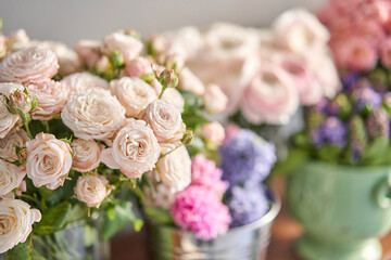 Many different flowers on Showcase. Background of mix of flowers. Beautiful flowers for catalog or online store. Floral shop and delivery concept.