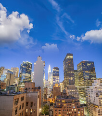 Fototapeta premium Manhattan skyline at sunset, aerial view of New York City