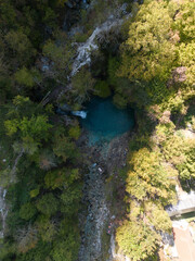 Naklejka na ściany i meble Drone perspective of the blue eye in the Albanian Alps