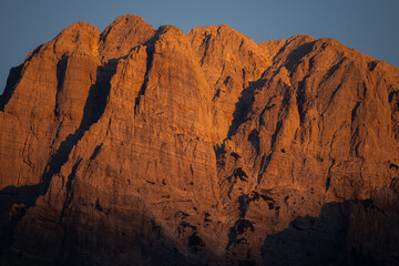 Sunset in the Albanian Alps near Theth. Red illuminated mountains.
