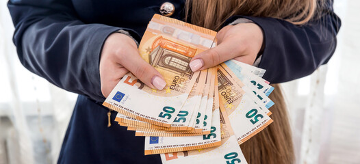 Female hands counting large amount EU euro money