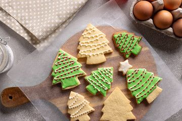 Decorated christmas cookies with copy space on grey background