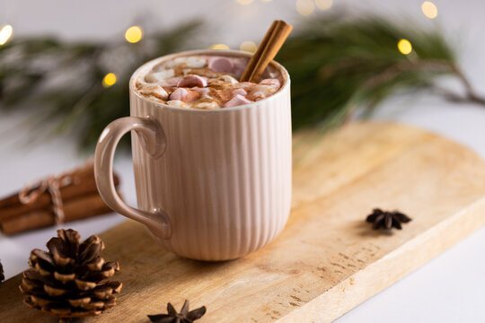 Naklejki Mug of chocolate and marshmallows and christmas decorations with copy space