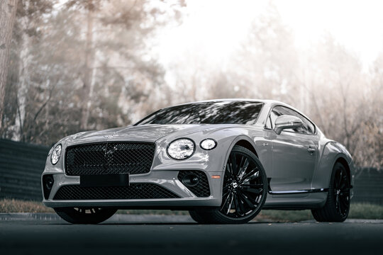 Novosibirsk, Russia -  October 11  , 2023:  gray  Bentley Continental GT Speed  parked in  park, side view