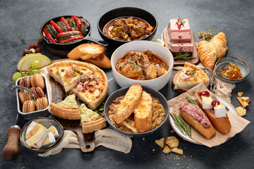 Traditional french food -mussel and meat dishes, ratatouille, snails, croissants, desserts, fresh pastries and cheese.