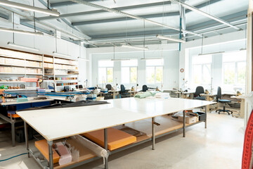 Interior of a sewing warehouse of furniture factory with equipment and materials