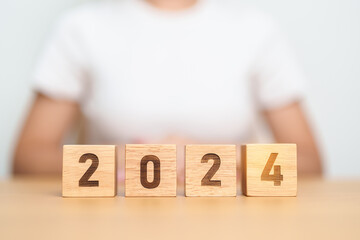 2024 year block on table. goal, Resolution, strategy, plan, start, budget, mission, action,...