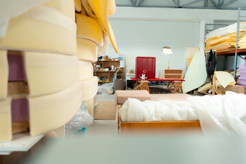 Stacked materials for furniture upholstery in furniture factory