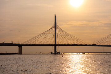 Fototapeta na wymiar Bridge on the river at sunset