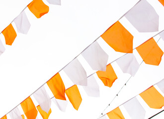Orange and white festive flags isolated on white background