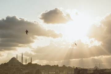 Istanbul background photo with sunrays through the clouds and Suleymaniye Mosque