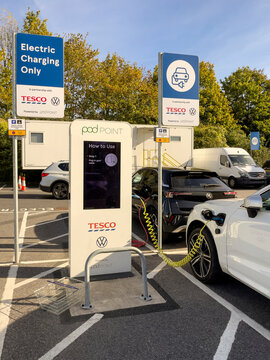 Winchester, Hampshire, England, UK. 15.10.2023.  Electric car charging point in a supermarket car park, Winchester Hants.