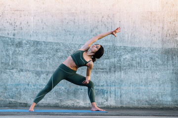 Healthy woman training yoga asana