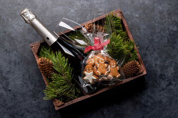 Box with Christmas gingerbread cookies and champagne