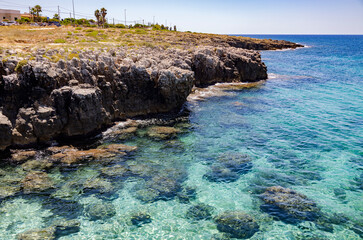 Turquoise waters in the seaside locality of Posto Rosso, Marina of Alliste in the province of Lecce, Salento, Puglia, Italy